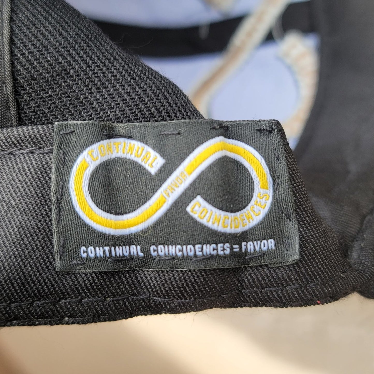 Continual Coincidences Snapback Hat